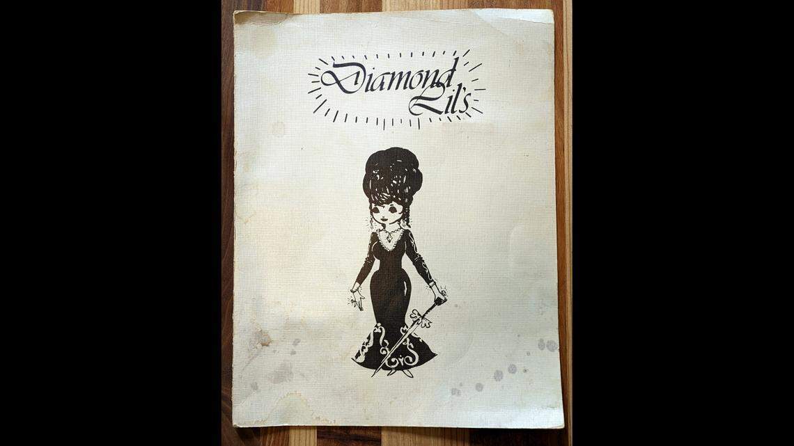 Front of a menu from Diamond Lil’s. The menu, which is 9.75 inches wide by 12.75 inches high closed, features the Diamond Lil caricature of Krupp. Courtesy of Tom Green