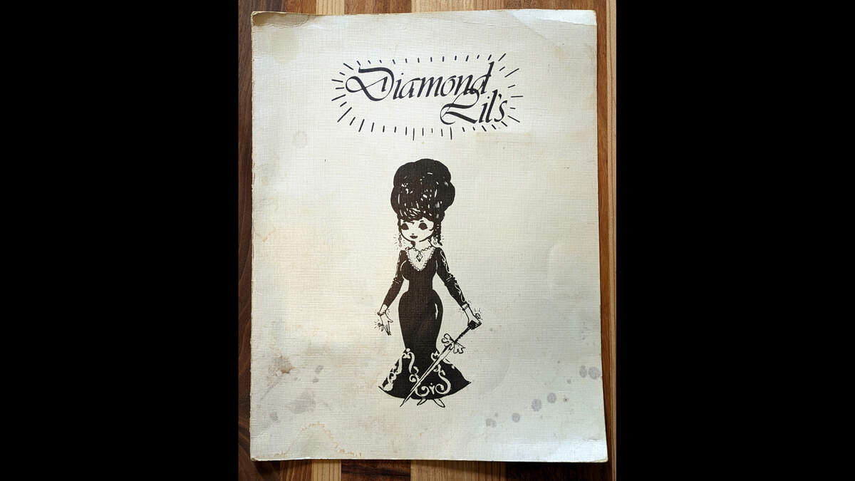 Front of a menu from Diamond Lil’s. The menu, which is 9.75 inches wide by 12.75 inches high closed, features the Diamond Lil caricature of Krupp. Courtesy of Tom Green