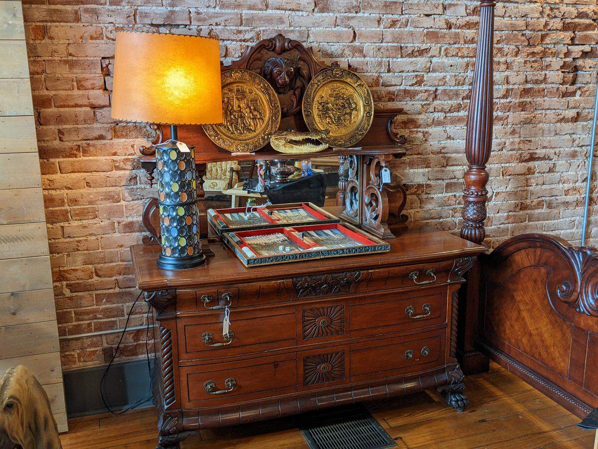 A display with restored furniture and decor at the Voodoo Alligator
