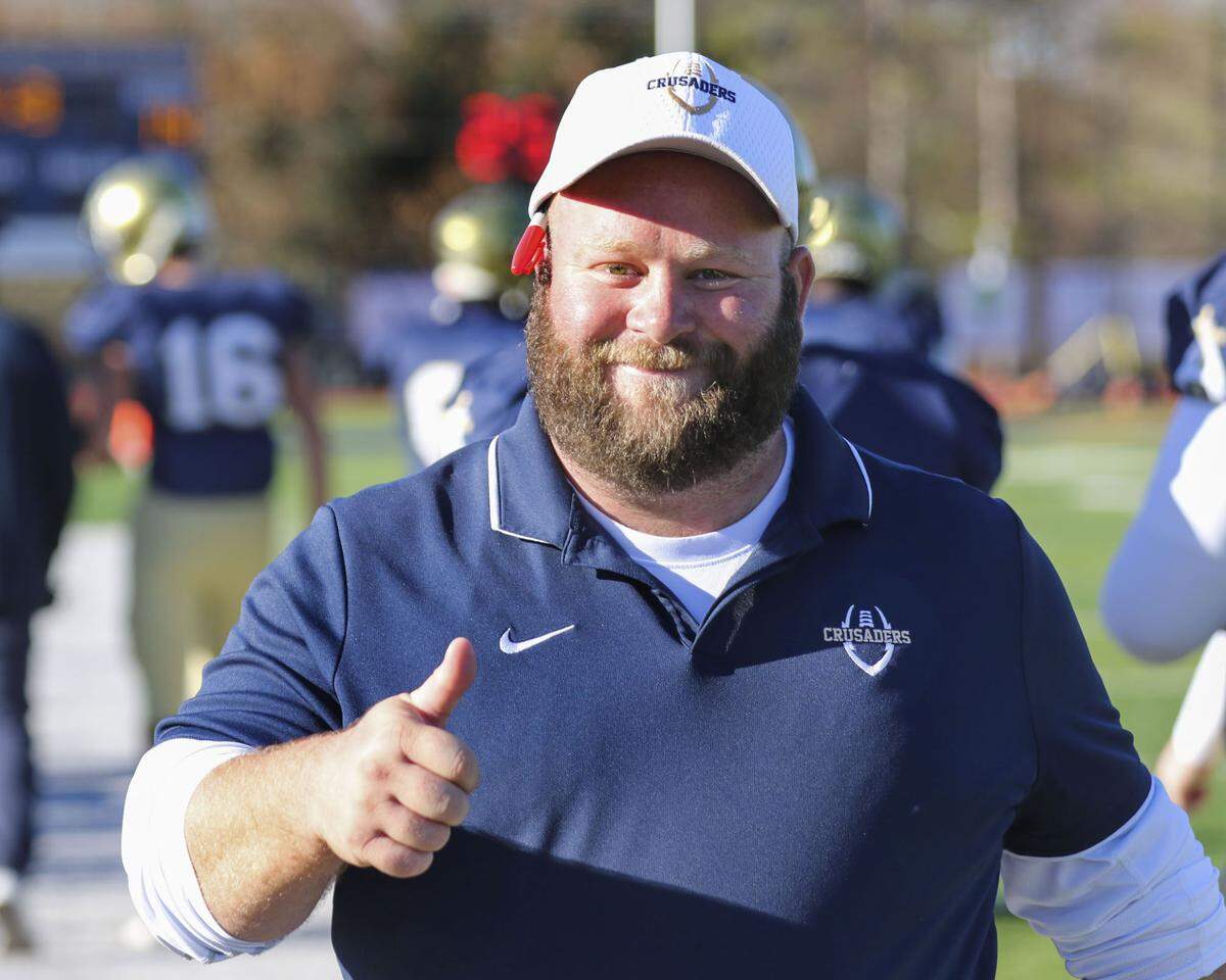 Althoff’s head coach Austin Frazier is all smiles as the clock winds down during an IHSA Class 2A second round playoff game against Red Bud. The Crusaders prevailed 26-14 and now advance to the quarterfinal round.