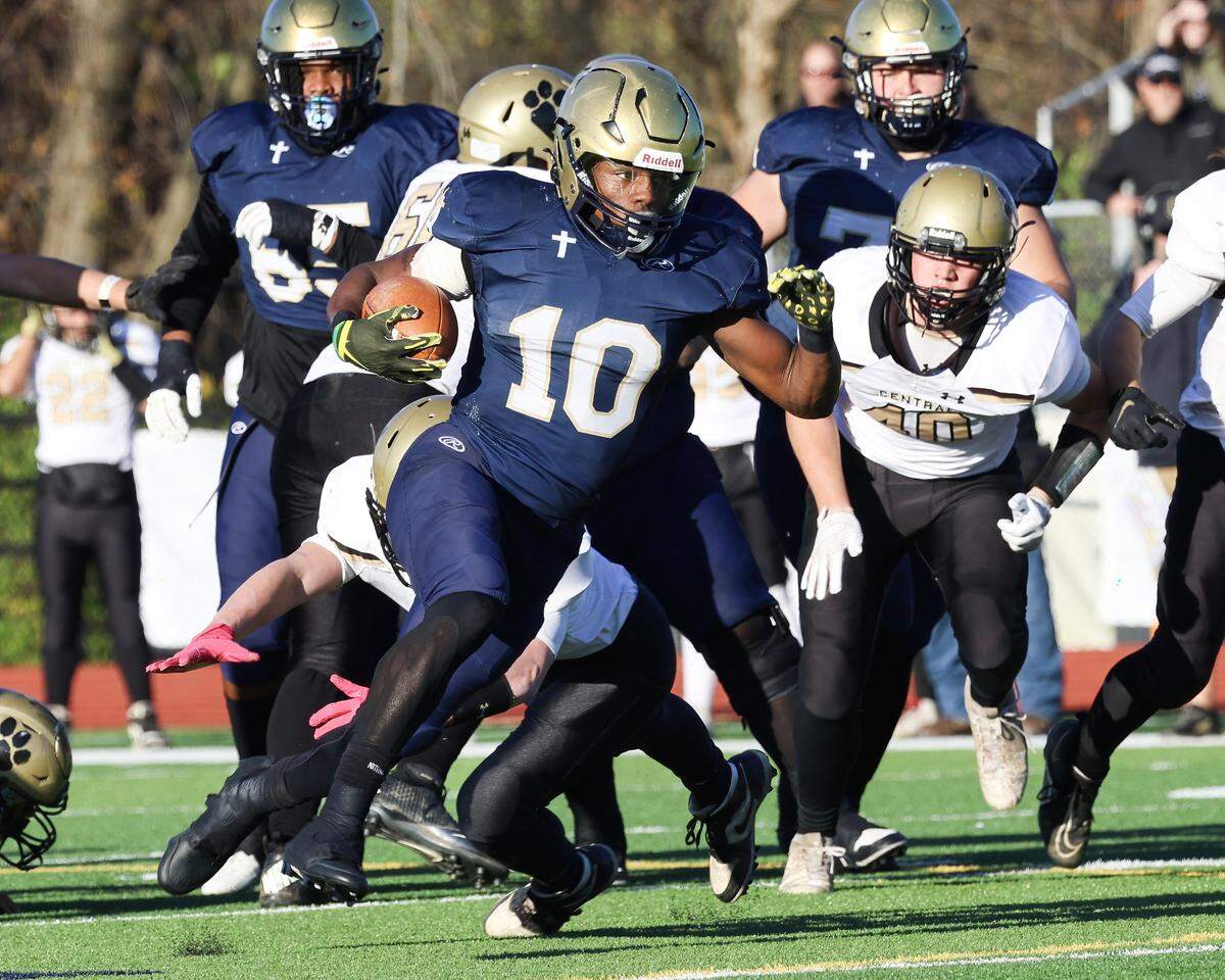 Althoff running back Dierre Hill Jr. carries the ball for one of his five touchdowns against Camp Point Central in Saturday’s IHSA Class 1A semifinal game. The 58-19 win advances the Crusaders to the championship game next Friday at Illinois State University where they will face Lena-Winslow.