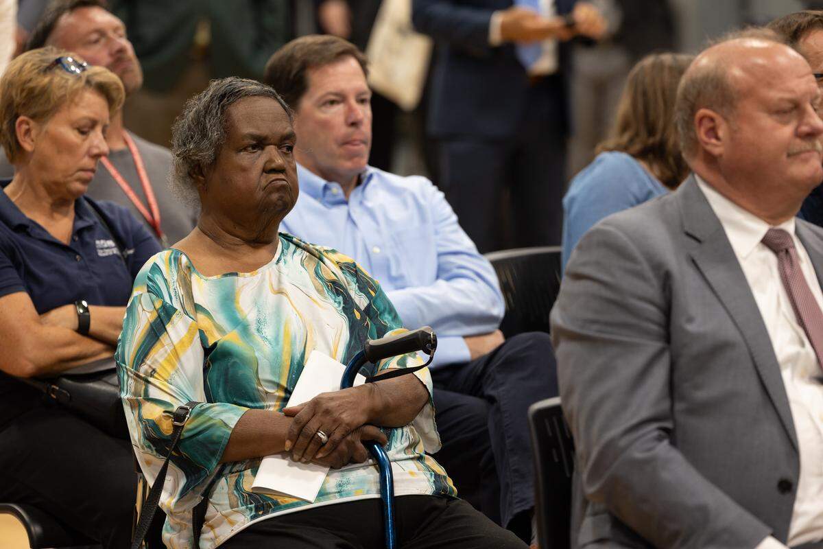 Cahokia Heights resident Sheila Gladney listens to U.S. Rep. Nikki Budzinski speak about infrastructure projects in the city.