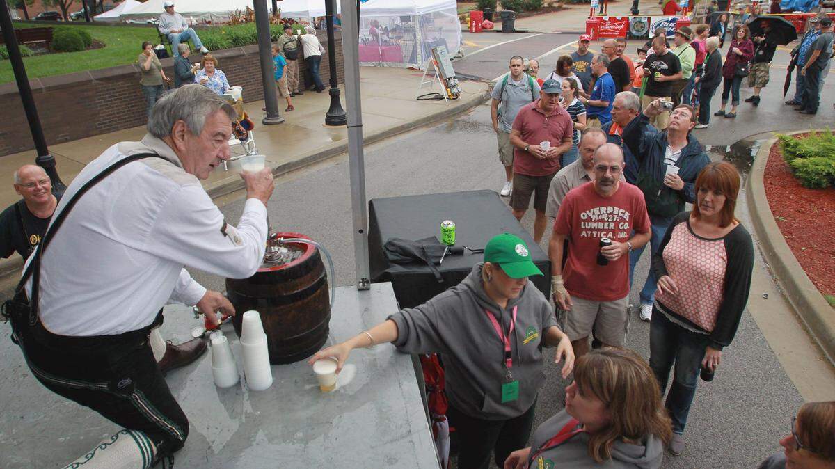 Bob Fritz fills glasses of beer from the Golden Half Keg to kick off Oktoberfest in 2015. Oktoberfest runs 11 a.m. to 11 p.m. Friday and Saturday in Downtown Belleville.