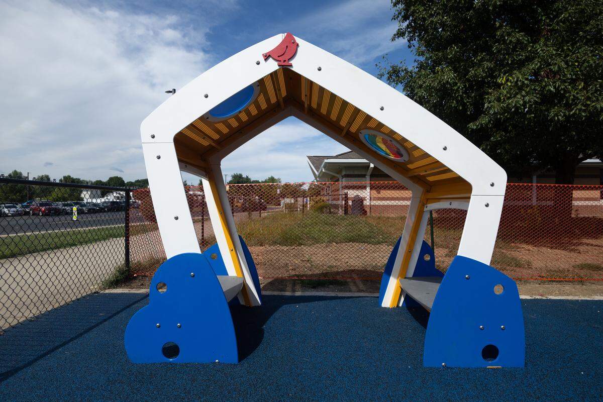 One of the components of inclusive playgrounds are spaces where children can use imagination to picture the structure as whatever they wish it to be and those that provide a calm space for when children get overstimulated. This is such a space, with low-lying benches that are easily accessible for most children.