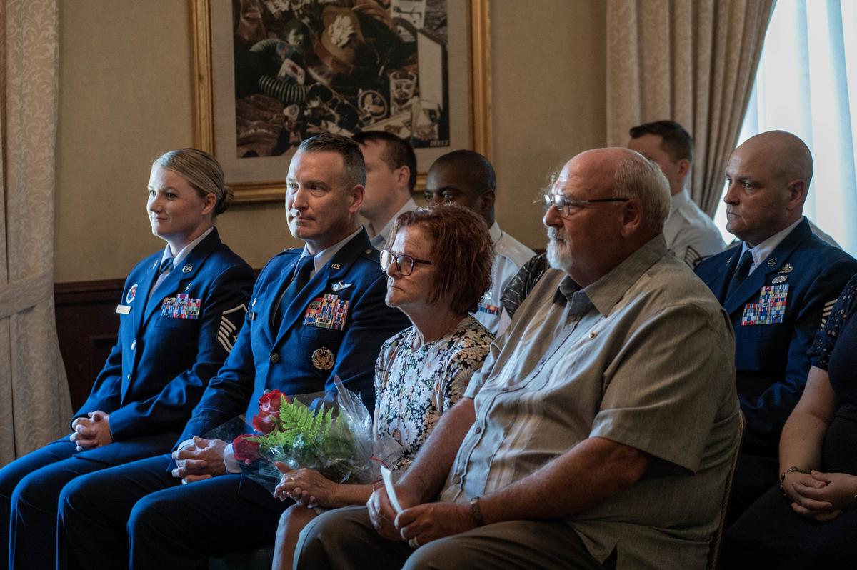 Scott Air Force Base leadership sits next to deceased Senior Airman Bradley Smith’s parents at a ceremony June 17 in the Essex House on Scott Air Force Base. The ceremony took place for Smith, and a room in the Chief Master Sgt. of the Air Force Bud Andrews Airman Leadership School dedicated to him for his courageous acts while deployed in Afghanistan.
