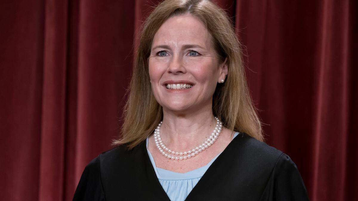 Associate Justice Amy Coney Barrett joins other members of the Supreme Court as they pose for a new group portrait, at the Supreme Court building in Washington, Friday, Oct. 7, 2022. Justice Barrett was nominated by President Donald Trump to succeed Justice Ruth Bader Ginsburg and has served since 2020. (AP Photo/J. Scott Applewhite)
