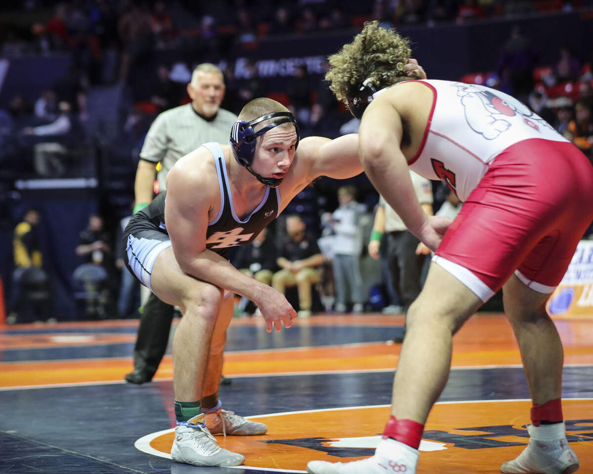 Belleville East’s Dominic Thebeau wrestles Grant’s Cameron Lattimore during their preliminary match at the 2023 IHSA Individual Wrestling State Finals on Thursday in Champaign. Thebeau scored a 13-2 win.