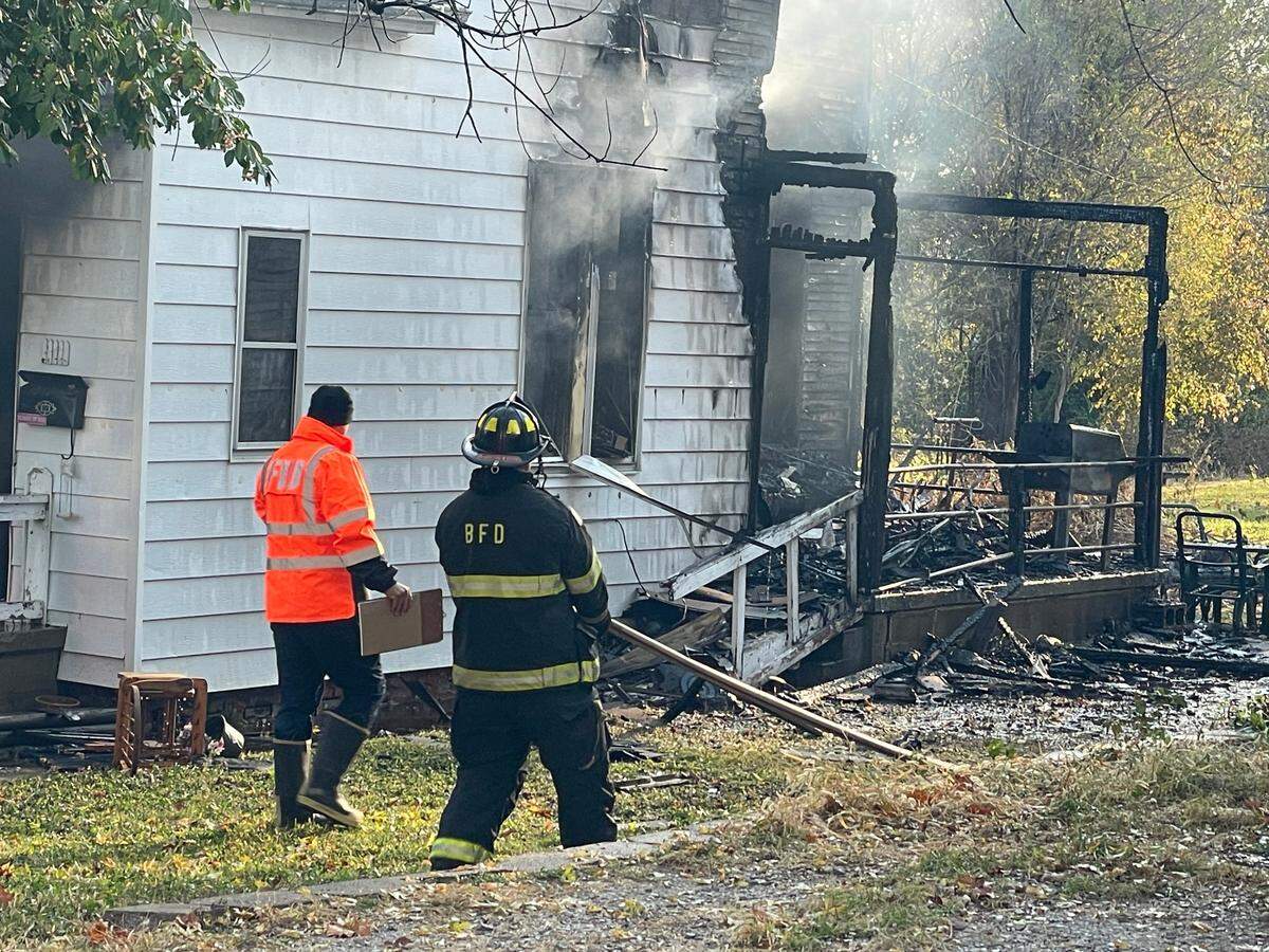 Belleville firefighters work the scene of a fatal house fire in the 100 block of South 13th Street early Monday morning.