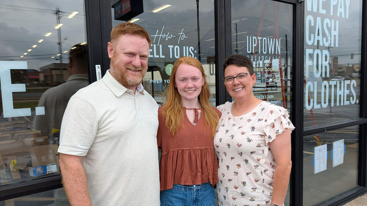 Mark and Laurie Byham, owners of Uptown Cheapskate in Fairview Heights, with their daughter Haley