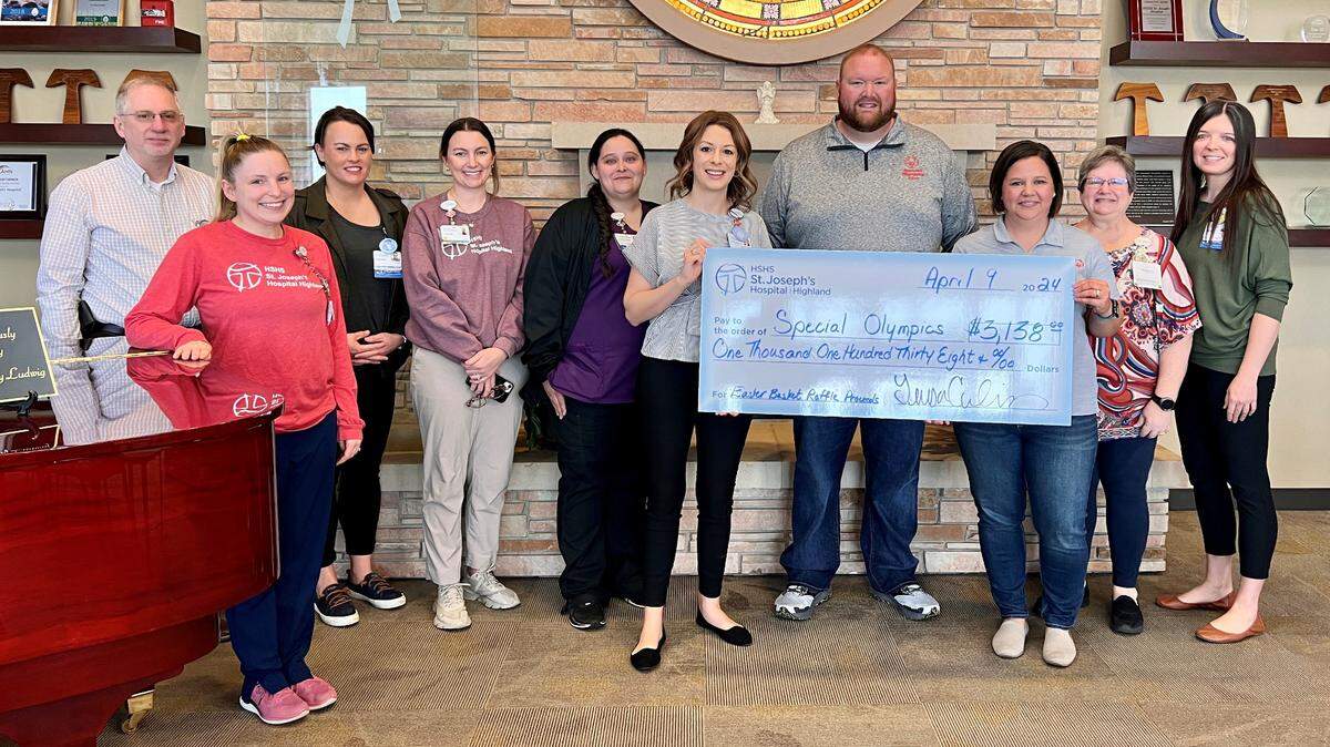 HSHS St. Joseph’s Hospital Highland leaders and Mission committee members presented a donation check for $3,138 to Special Olympics Illinois Region J. Funds were raised through a hospital-wide basket raffle event planned by the Mission Integration Committee. Pictured from left to right are Dana Stephens, Lyndsey Gelly, Cassie Lange, Courtney Holtgrave, Trisha Ernst, Teresa Cornelius, Tim Stempel and Katy Gruen of Special Olympics Illinois Region J, Sheri Ernst and Rachael Ray.