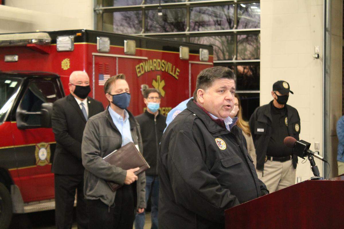Gov. J.B. Pritzker speaks at a news conference in Edwardsville Saturday afternoon following the collapse of an Amazon warehouse that killed at least six people Friday.