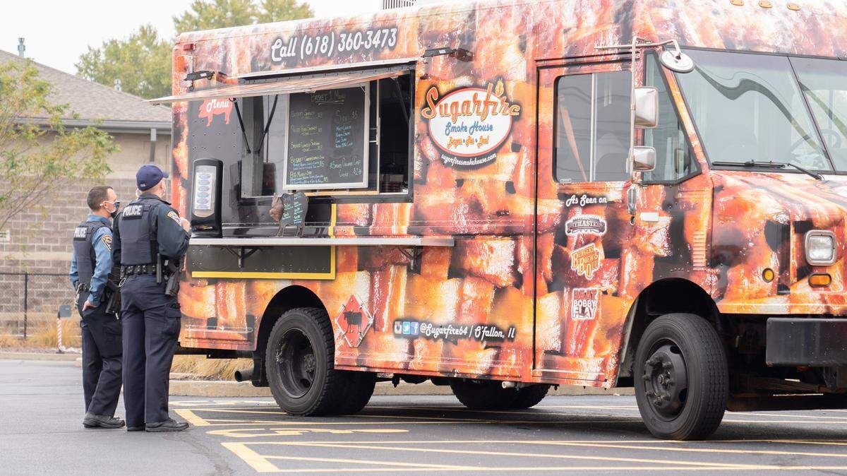 O’Fallon first responders check out the Sugarfire Food Truck offerings as part of an appreciation lunch that honored police, fire and EMTs. An ambassador for Operation Gratitude, Sara Field approached the O’Fallon-Shiloh Chamber of Commerce and local businesses about planning the appreciation lunch, which was a big success.