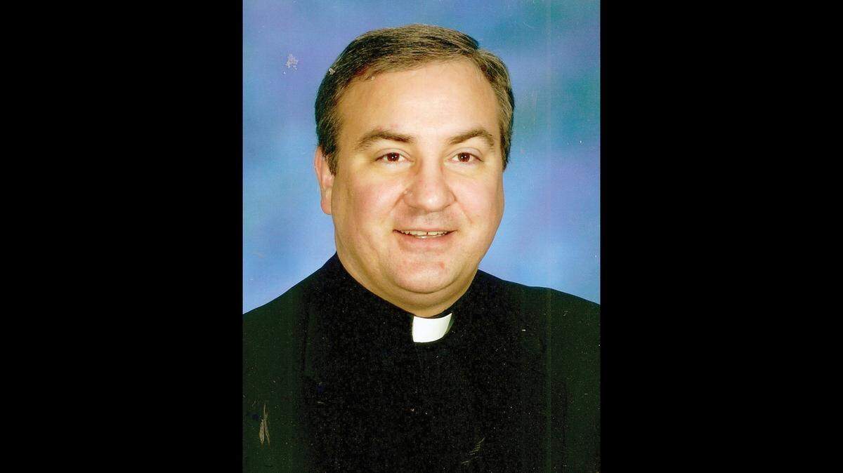The Rev. Michael G. McGovern is shown as a young priest in the Catholic Archdiocese of Chicago, where he has served for 26 years.