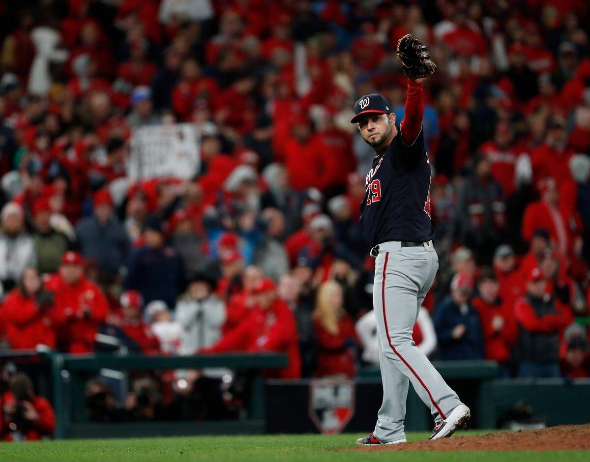 Washington Nationals starting pitcher Anibal Sanchez acknowledges an ovation by Busch Stadium fans after being relieved after giving up his first hit during the eighth inning of Game 1 of the baseball National League Championship Series against the St. Louis Cardinals on Friday, Oct. 11, 2019, in St. Louis. (AP Photo/Jeff Roberson)