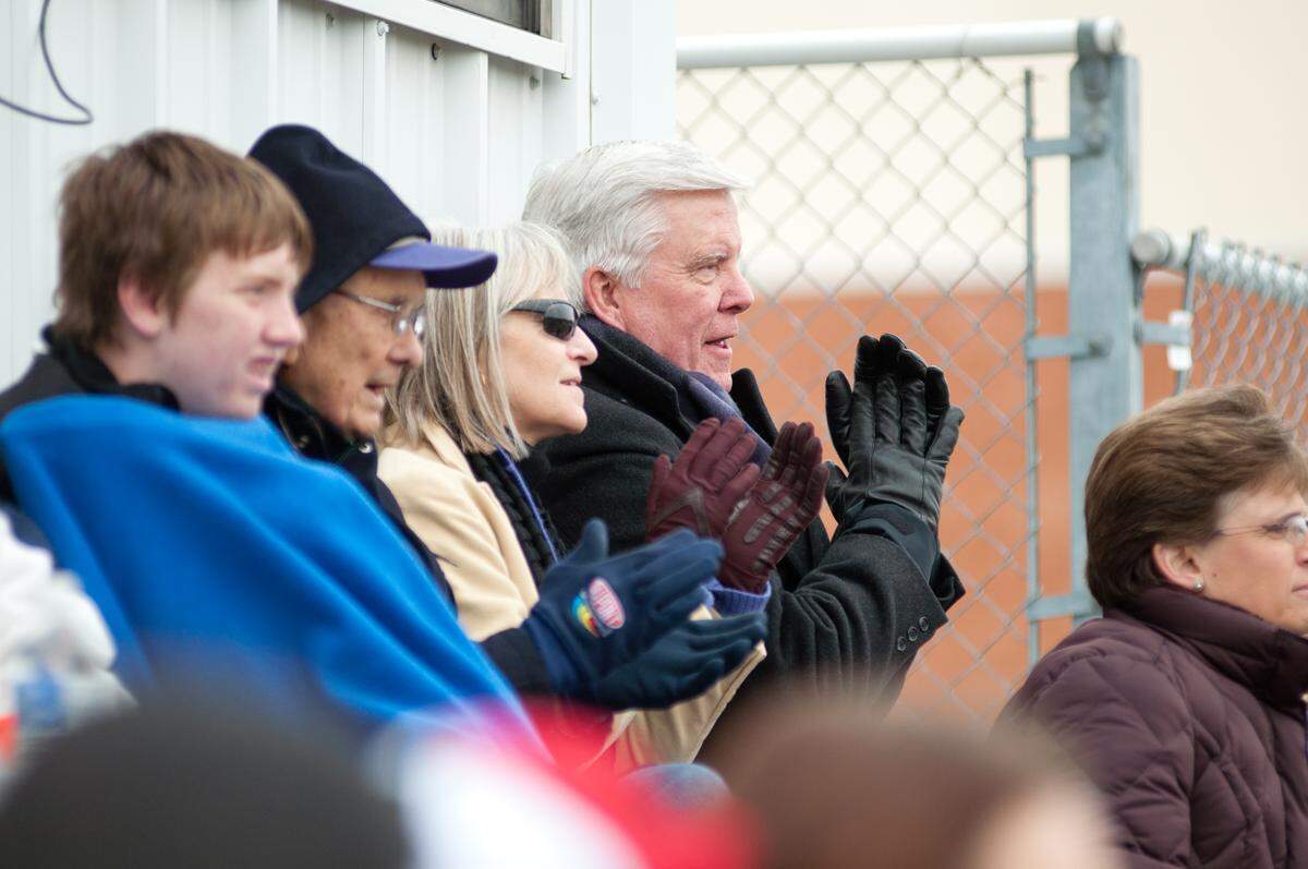 McKendree University President James Dennis, center, watches a football game at Leemon Field with Cynthia Cherrey a few years ago. They married in 2016.