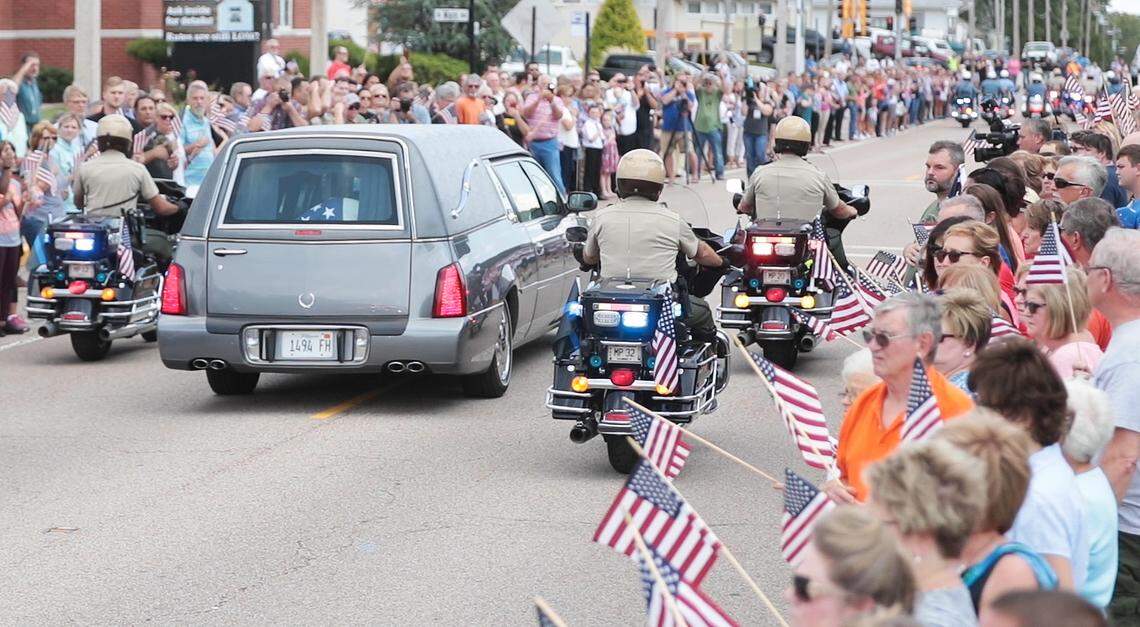 West 4th Street outside of Waterloo City Hall was lined with supporters as a police-led procession transported Hopkins from St. Louis, through town and to Quernheim Funeral Home in Waterloo.