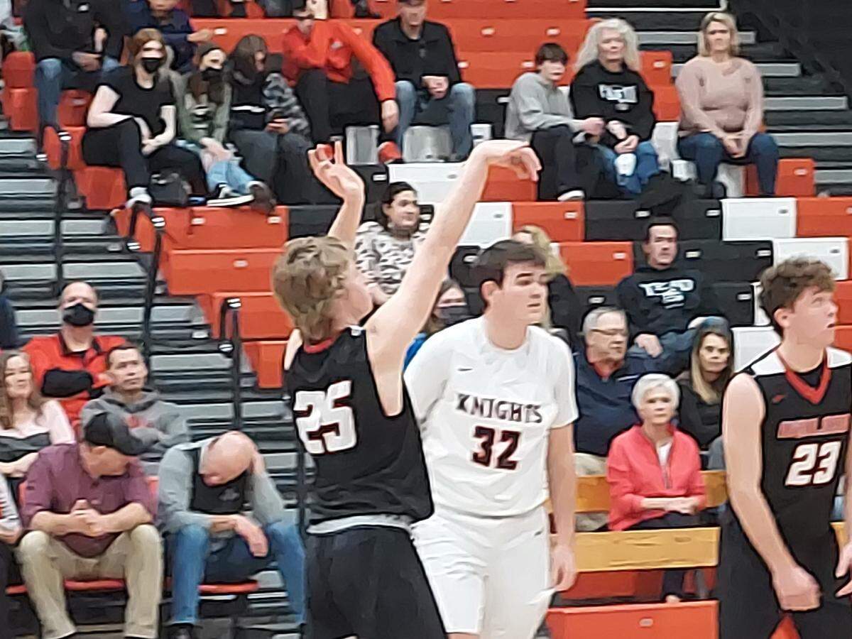Highland’s Trey Koishor shoots a free throw during a Mississippi Valley Conference game against rival Triad on Tuesday, Feb. 8. The Bulldogs defeated the host Knights 39-30.