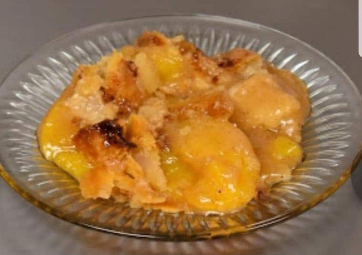Good Heavens BBQ & Bakery in East St. Louis serves housemade peach cobbler, shown here, as well as caramel cake, pound cake and other desserts.