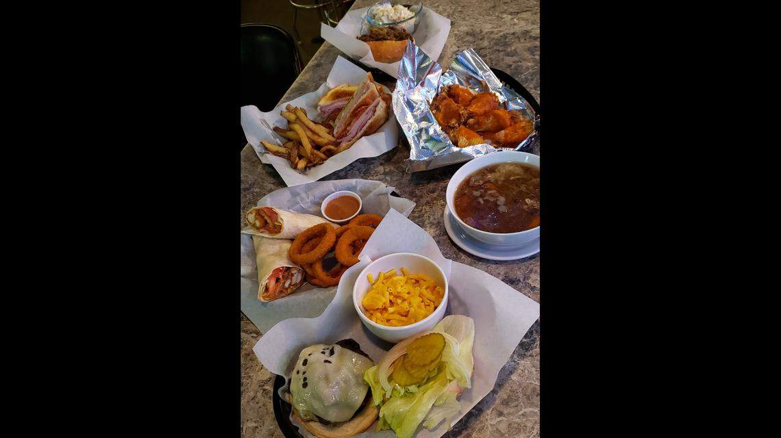 Big O’s bar and restaurant in Madison serves, clockwise from top, Italian beef, wings, housemade soups, burgers, wraps and sandwiches.