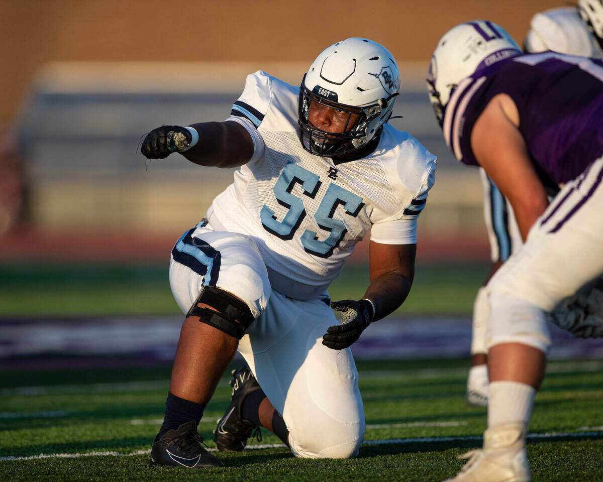 Belleville East’s Anthony Cunningham points instructions during Friday night’s season opener against Collinsville. The Lancers ultimately prevailed 20-12.