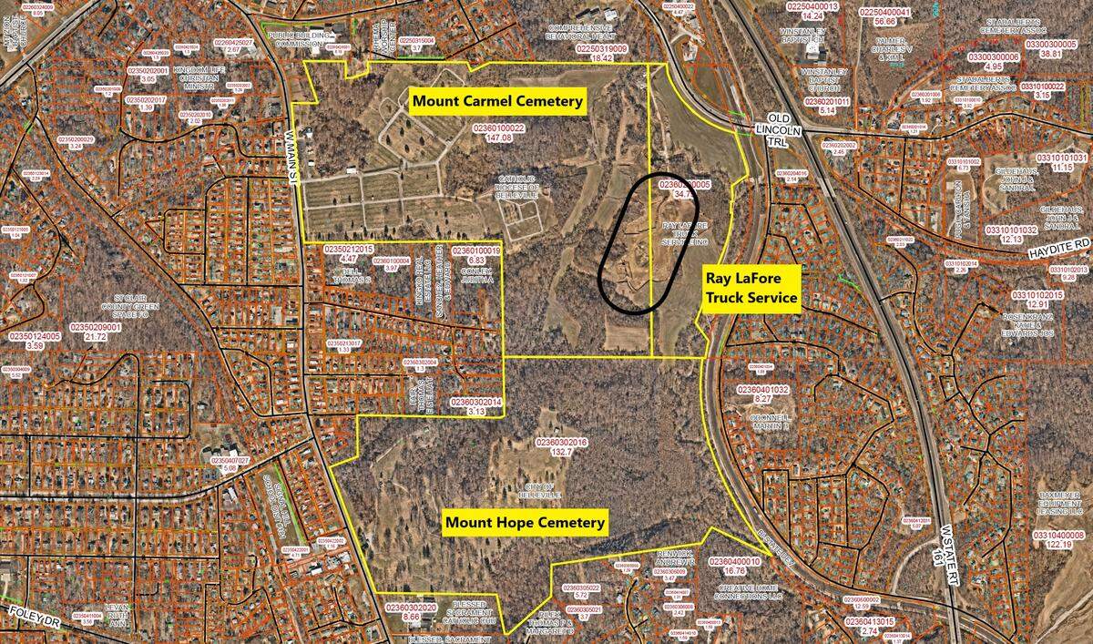 This St. Clair County parcel map shows yellow boundary lines of Mount Carmel Cemetery, Mount Hope Cemetery and property owned by Ray LaFore Truck Service in west Belleville. A borrow pit and roads leading to it are circled in black.
