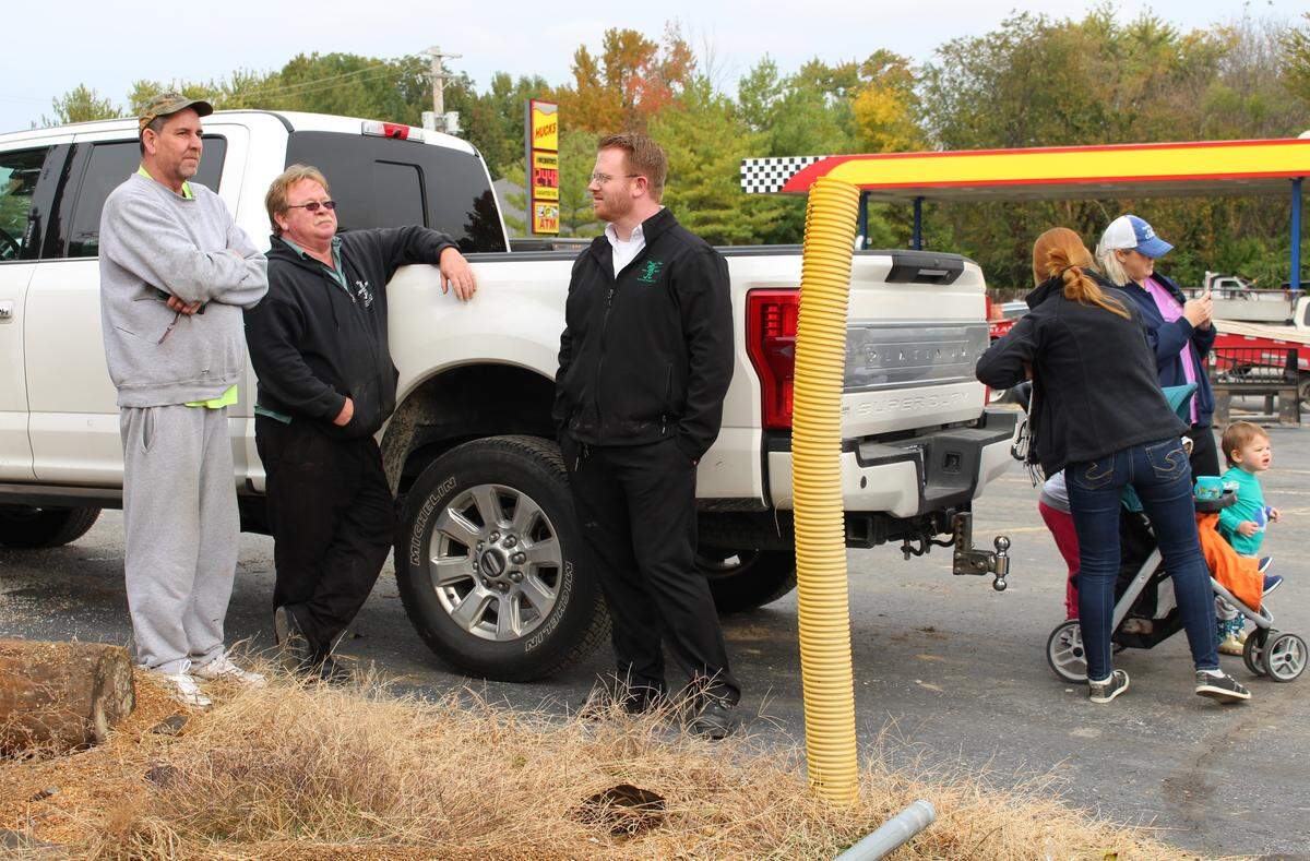 Former owner Mark Daniels, leaning on truck, watches the former Dandy Inn building being demolished with his son, Casey, right, and longtime customer Andrew Jacobs on Thursday morning.