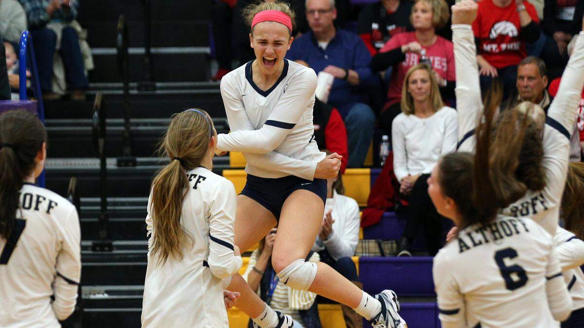 Althoff’s Karinna Gall celebrates with teammates after scoring during the Civic Memorial Super Sectional game between Mt. Zion and Althoff Friday night in Bethalto.