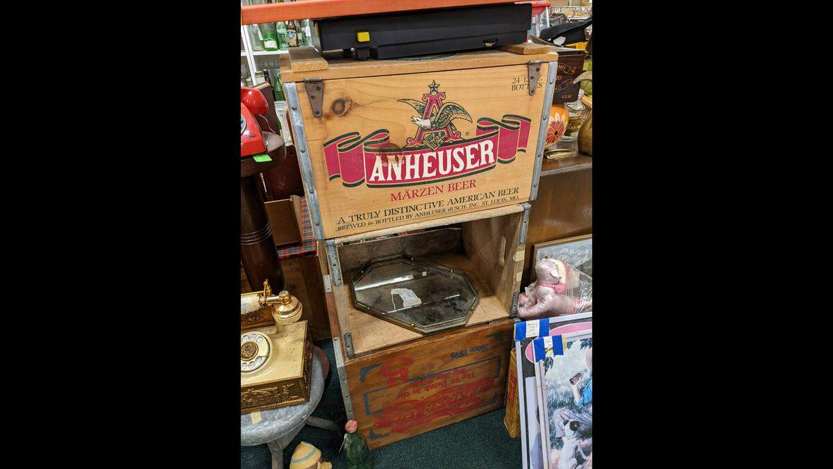 A wooden beer crate among the other items at J&P’s Edelweiss in Alton