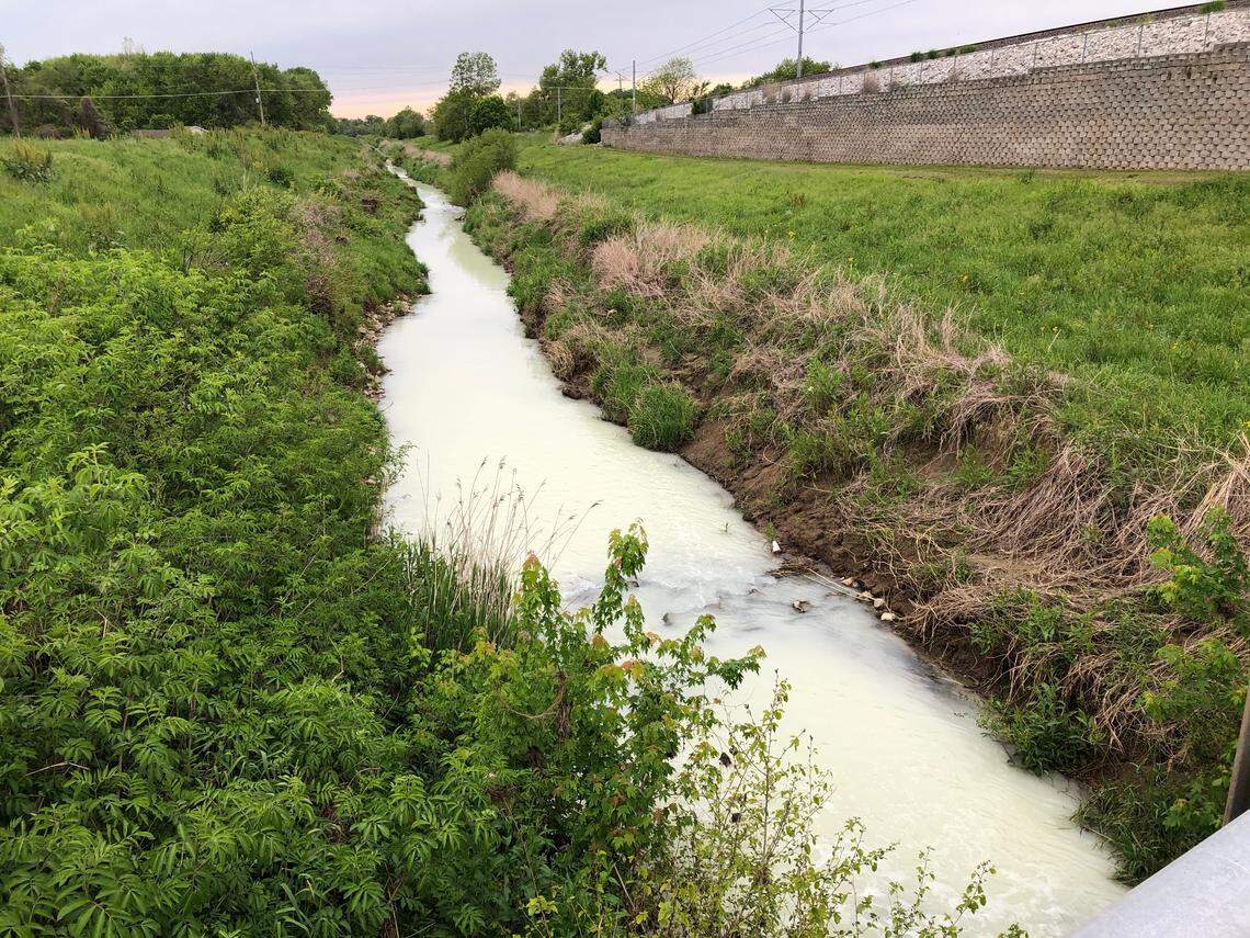 A miles-long portion of Schoenberger Creek, which runs between East St. Louis and Belleville, had turned a whitish color by Monday evening.