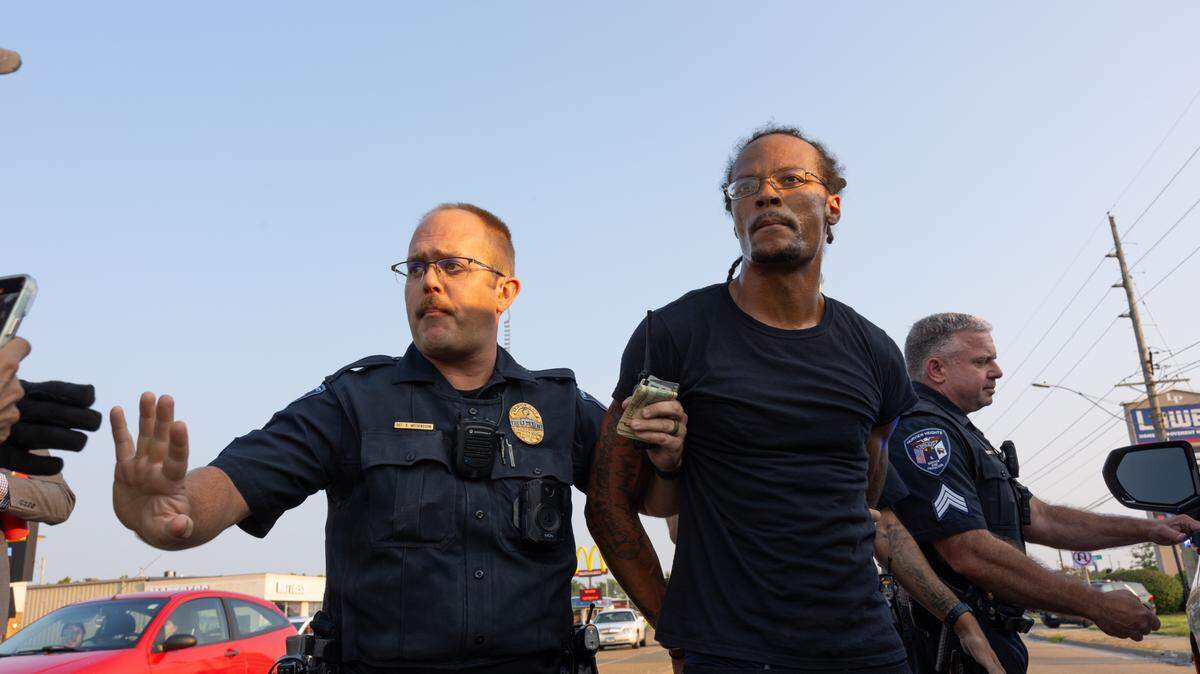 J.D. Dixon is apprehended during a protest in Fairview Heights on July 24, 2024 against the police killing of Sonya Massey in her Springfield, Ill. home. Dixon was charged with three misdemeanor crimes and released roughly an hour after his arrest.