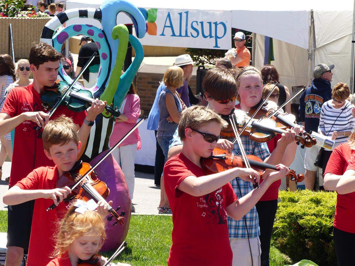 Young musicians perform at Art on the Square in downtown Belleville in this undated photo. This weekend, kids will be able to make things at the Children’s Art Garden and take them home.