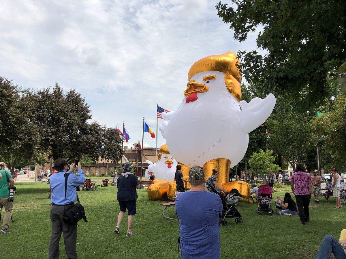 A giant chicken with Trump-like hair was inflated by Trump protesters at a park in Granite City.