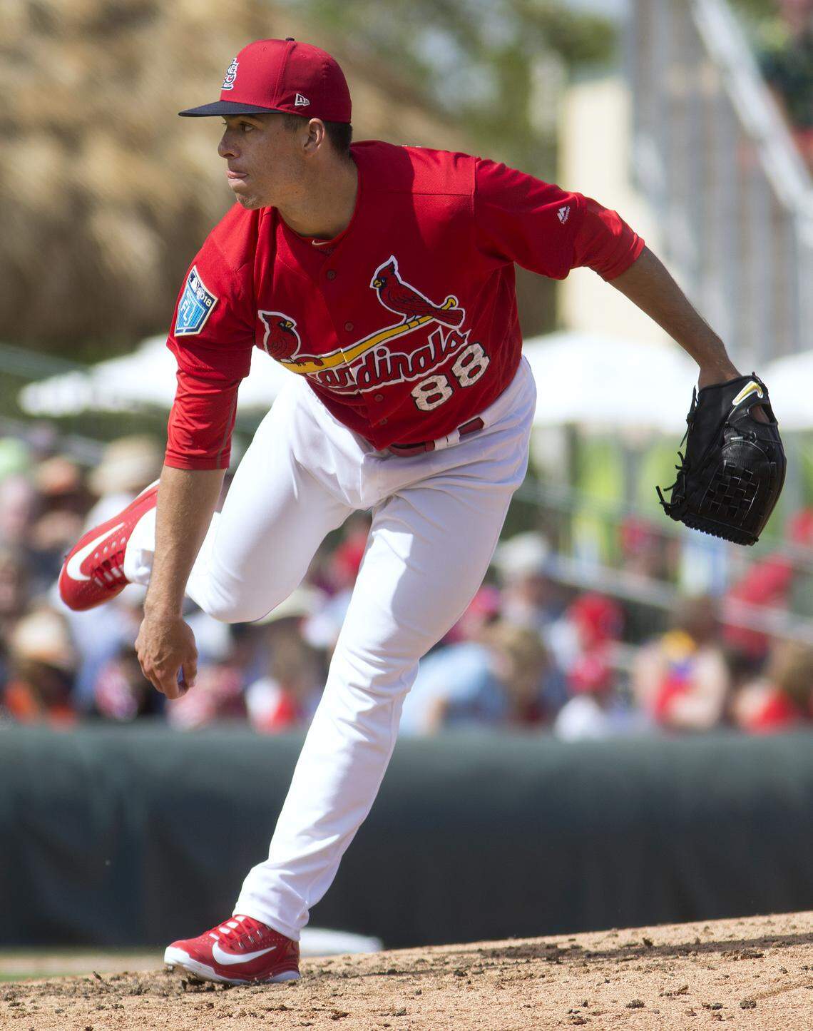 Pitcher Ryan Helsley pitches during a spring training game in Jupiter, Florida.