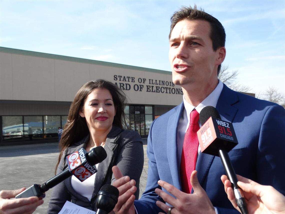 Republicans Jesse Sullivan and Kathleen Murphy speak with reporters Monday just before filing petitions to run for governor and lieutenant governor in the June 28 primary elections.