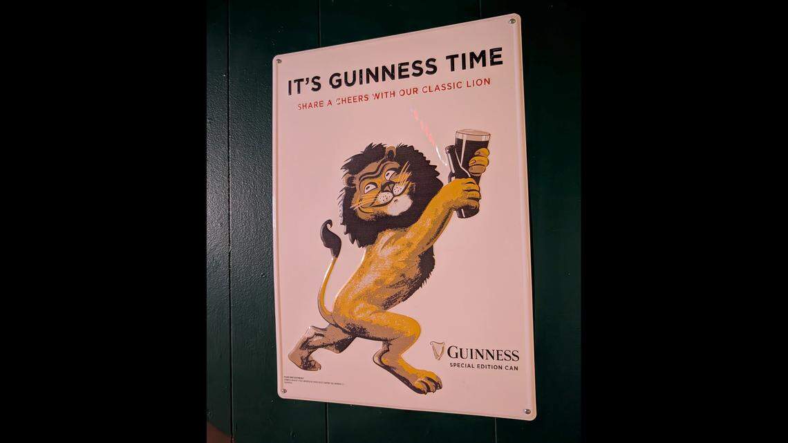 Beer memorabilia, like this Guinness sign, is displayed throughout Touchdown Bar & Grill.