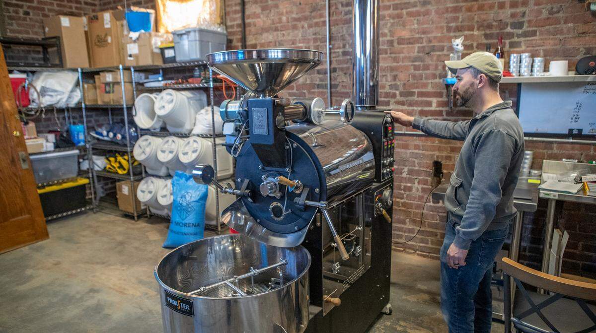 LongStory Coffee owner and head roaster Erik Busch shuts down the roaster in the future café and roastery at 732 S. Illinois St. in Belleville.