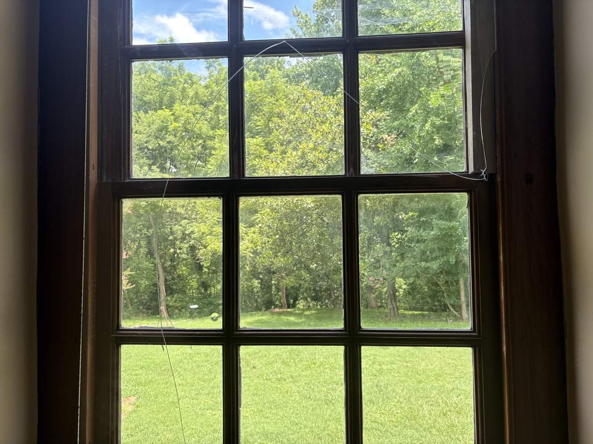Plexiglass from the lower window on the back right of the house was damaged, with the missing piece left in a historic crib in the first-floor bedroom.