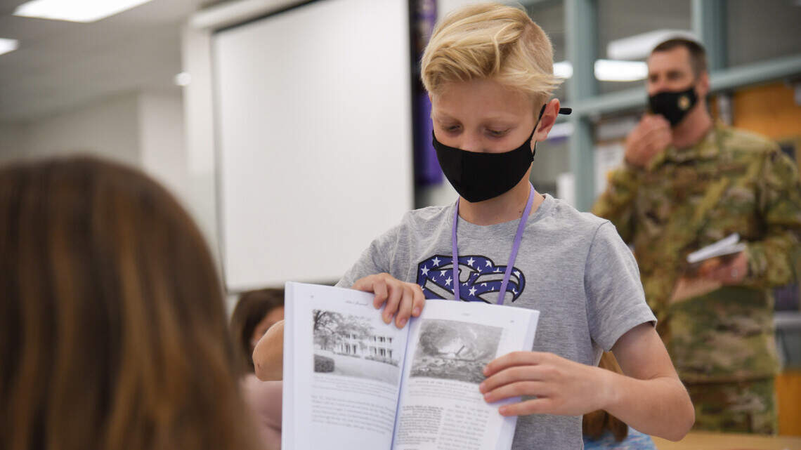 Air Mobility Wing chaplain reads family’s past to Scott Elementary School students