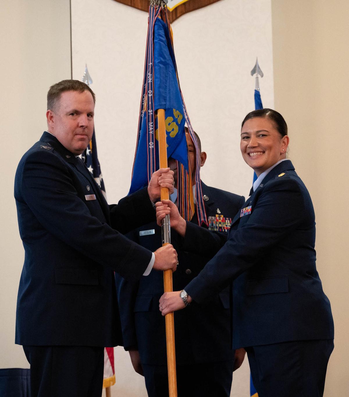 U.S. Air Force Maj. Angelina M. Urbina, 375th Force Support Squadron incoming commander, assumes command of the 375th FSS after receiving the guideon from U.S. Air Force Col. Jason J. Glynn, 375th Mission Support Group commander, during a change of command ceremony on Scott Air Force Base. The 375th Force Support Squadron provides quality of life services to the men and women of Scott, their families, plus the local community and surrounding a seven-state region.