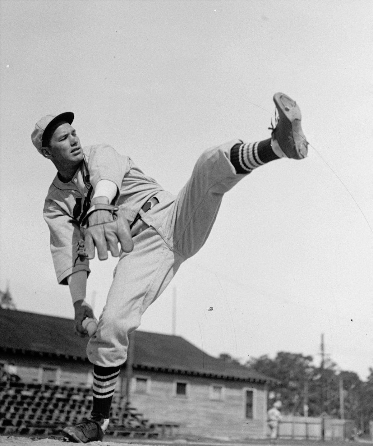 Dizzy Dean, St. Louis Cards’ ace hurler and long-time holdout, is shown shaking a leg as he makes up for lost practice time at the Cardinals’ spring training camp here March 24, 1936. (AP Photo)