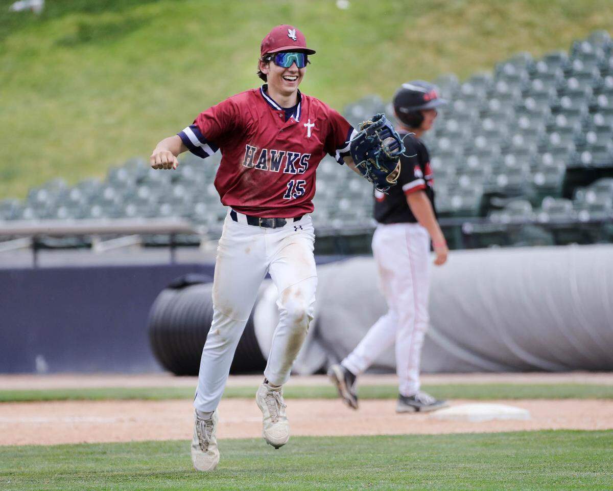 Gibault’s Tyler Frierdich celebrates after taking the last out at first base during Saturday’s IHSA Class 1A state championship game against Henry H-Senachwine at Dozer Park in Peoria. Gibault won 8-0 to secure the state crown.