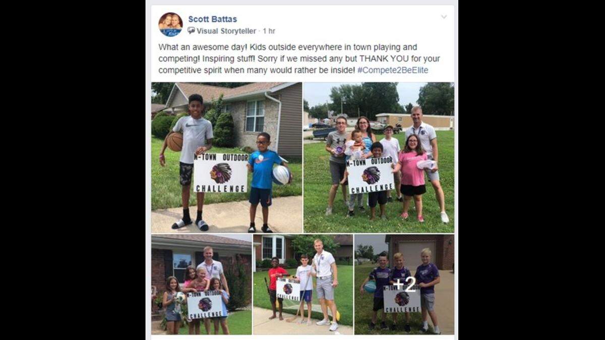 Mascoutah High School athletic director Scott Battas takes photos with children playing outside and then posts them on Facebook as part of the M-Town Outdoor Challenge.