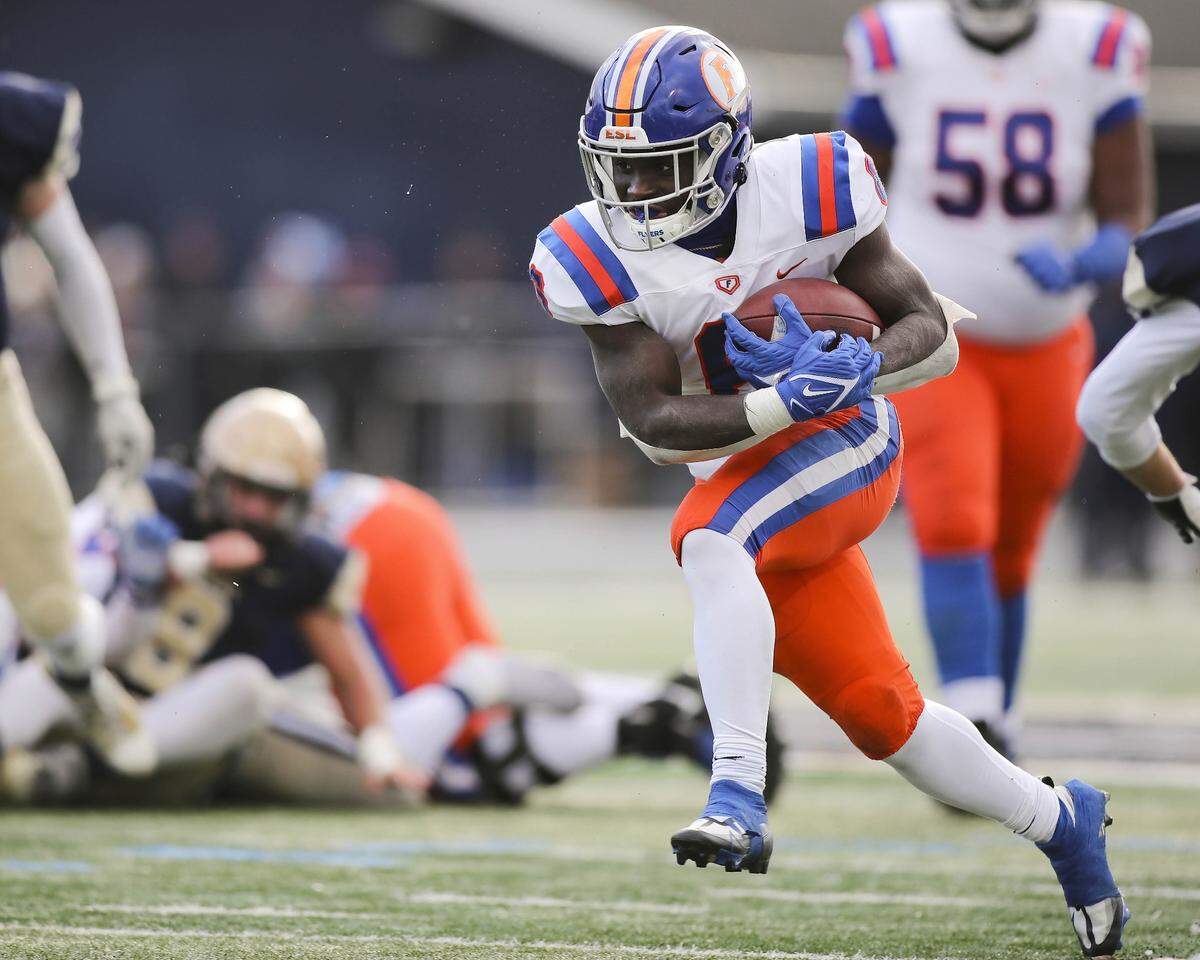 East St. Louis running back TaRyan Martin carries the ball during the IHSA Class 6A semifinals against Lemont. Martin helped lead the Flyers to a 32-29 victory and a spot in the state championship game.