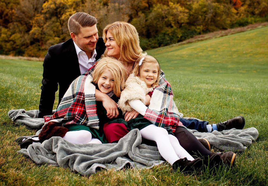 Jacob Post, Stephanie Biondi and their daughters, Leila, 6, and Bianca, 4, post for a family portrait last October.