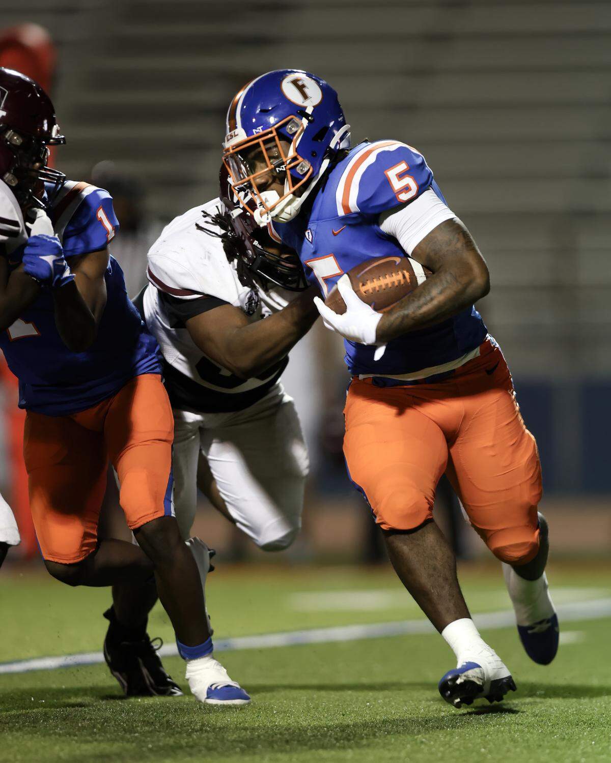 October 4, 2024 - East St. Louis Il, - East St. Louis’s Larevious Woods carries the ball during Friday night’s Southwestern Conference matchup between Belleville West and East St. Louis. [Photo: Chris Johns]
