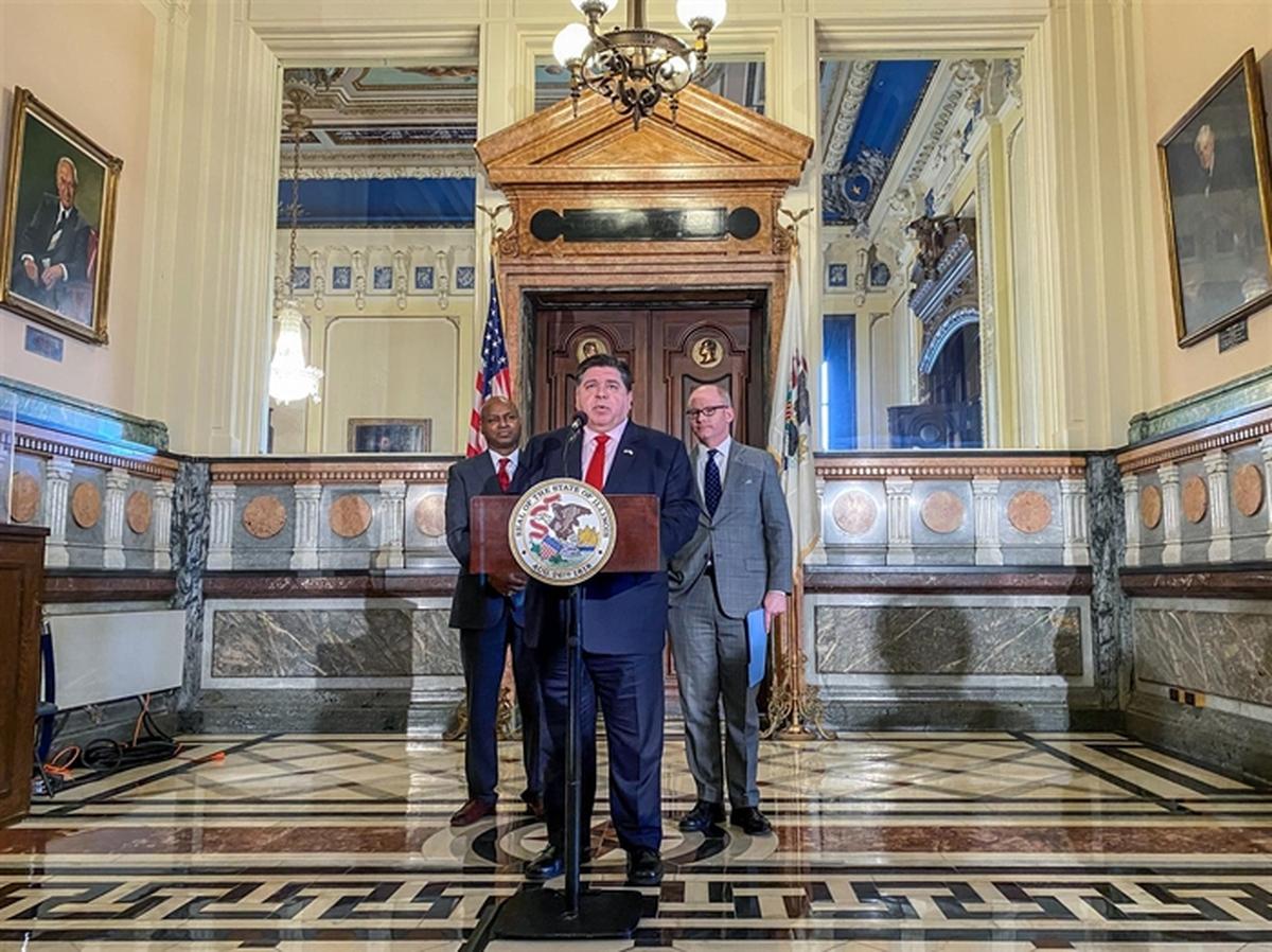 Gov. J.B. Pritzker is joined by House Speaker Emanuel “Chris” Welch, D-Hillside, and Senate President Don Harmon, D-Oak Park, at a news conference outside Pritzker’s office during the final week of session in April.