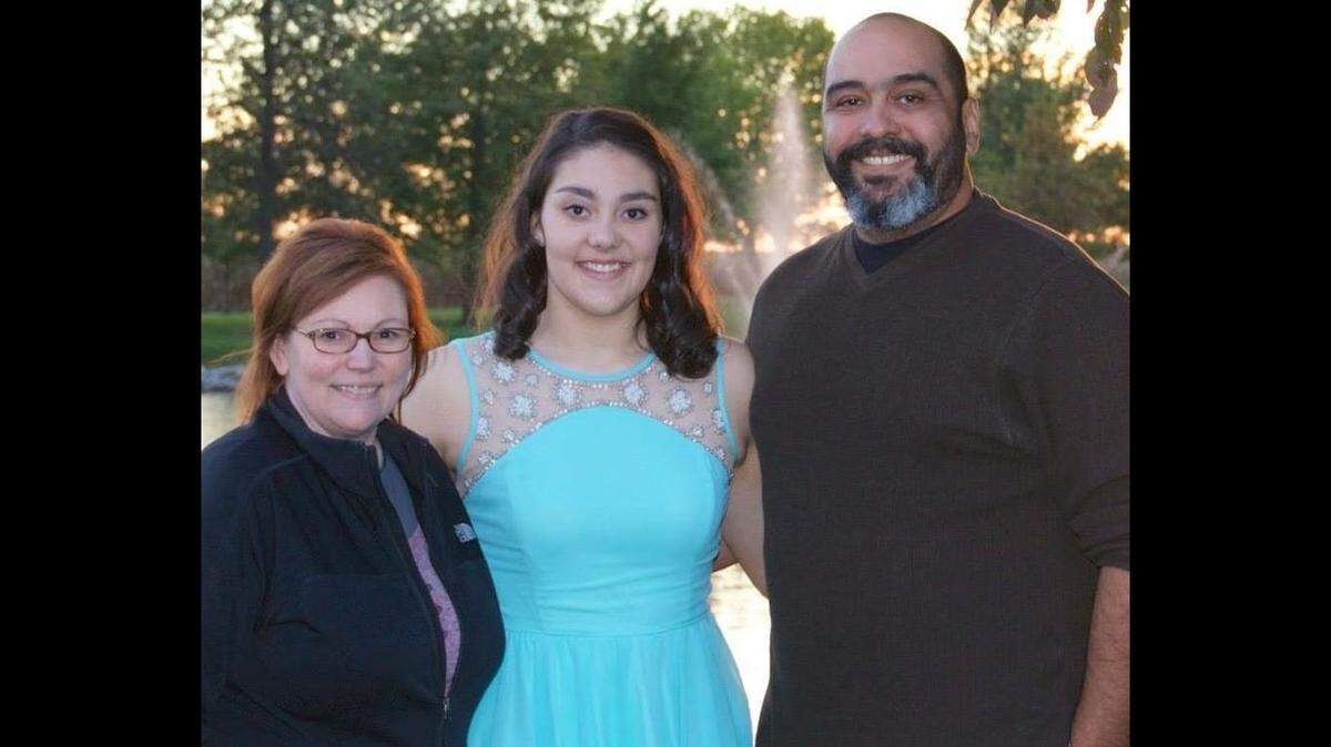Sydney Irizarry, center, is shown with her parents, Christina “Tina” and Andre Irizarry, in 2016, when she was a student at Central Community High School in Breese.