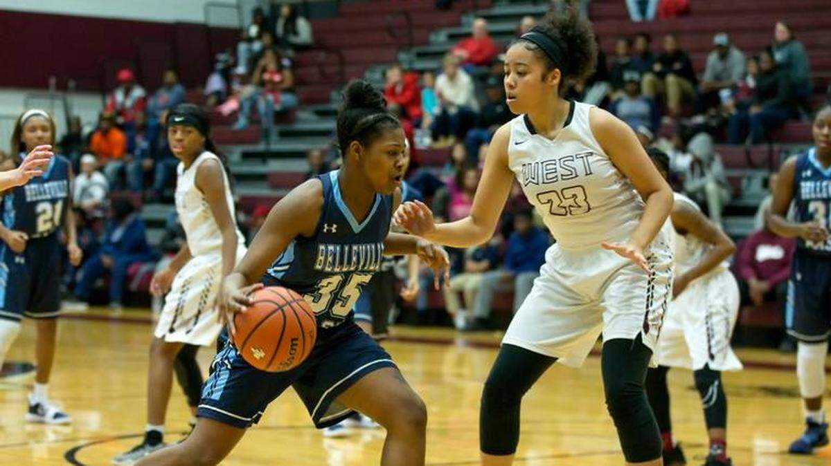 Belleville West’s Shaniah Nunn, right, in action against Belleville East earlier this season, scored 12 points Tuesday to help lead the Maroons to a 49-44 victory over Hillsboro.
