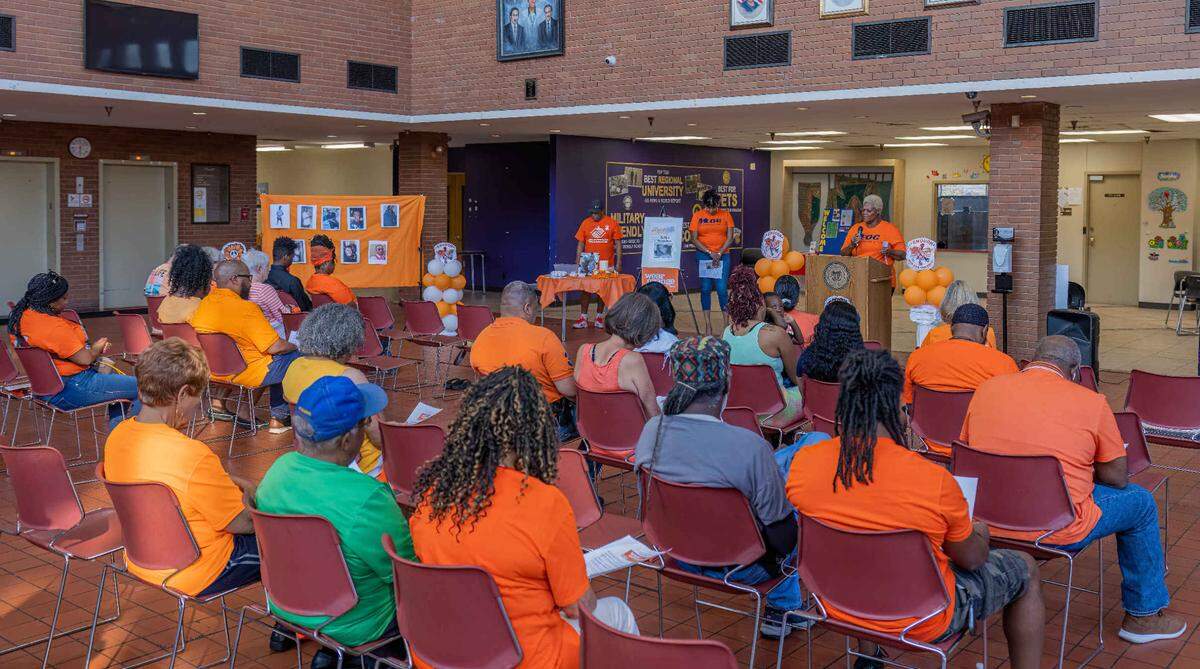 Elder Carolyn Rice-Smith of Empowerment of Grace Church opens the National Gun Violence Awareness Day event at the East St. Louis City Hall with a prayer.