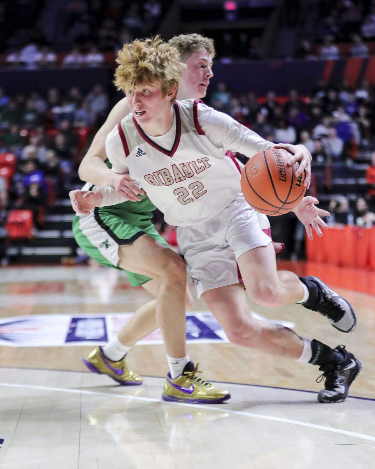 Gibault’s Hudson Blank drives to the basket during Saturday’s IHSA Class 1A state championship game against Scales Mounds at the State Farm Center on the campus of the University of Illinois. Gibault ultimately prevailed 65-45 to claim the state title.